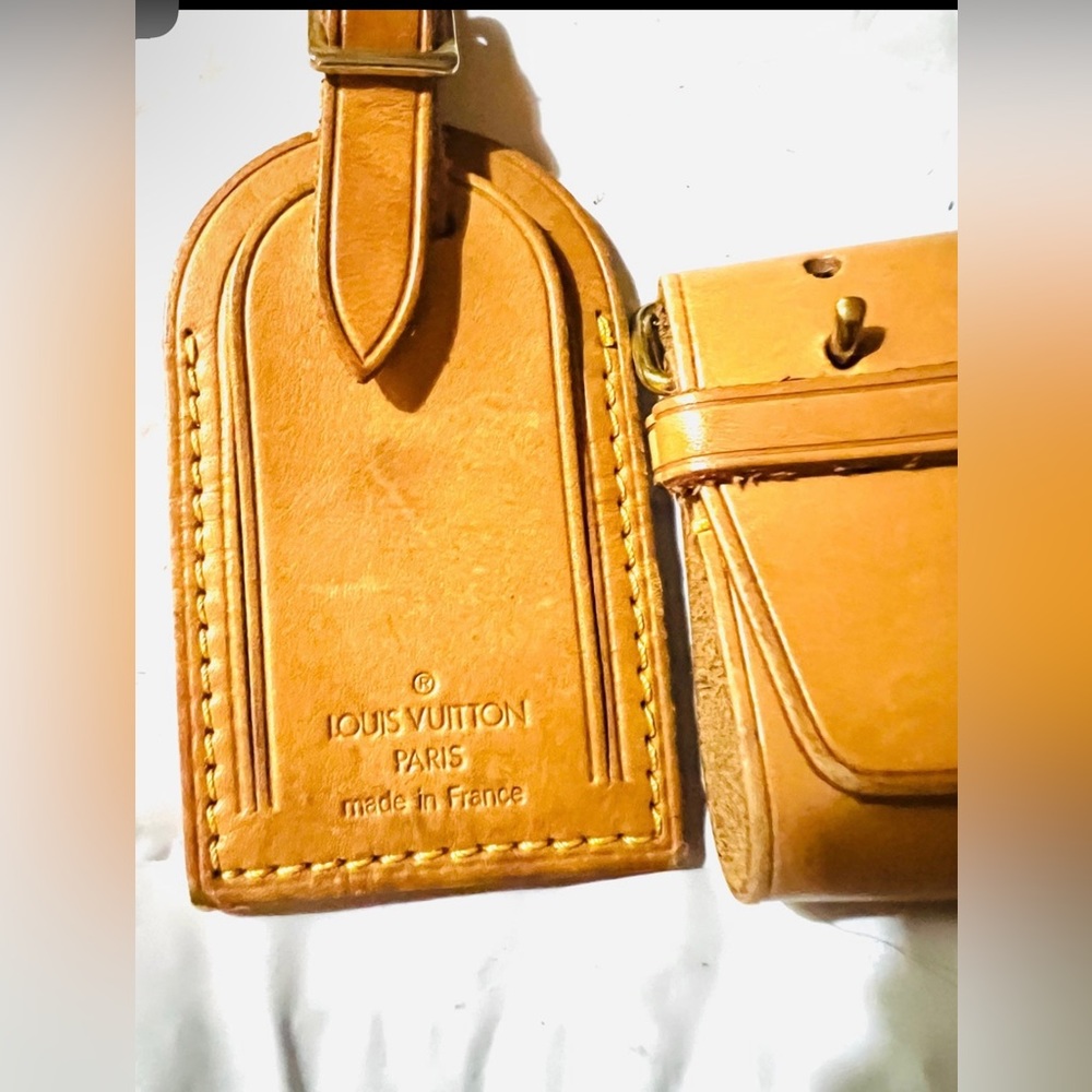 Authentic Louis Vuitton LV Name Tag and Poignet set Pre-owned.